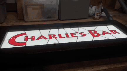 charlies bar-lighted sign