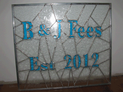 Glass panel highlighting bride and groom's wedding year